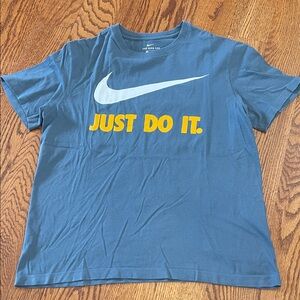 Nike Blue Tee with Swoosh and golden Text
